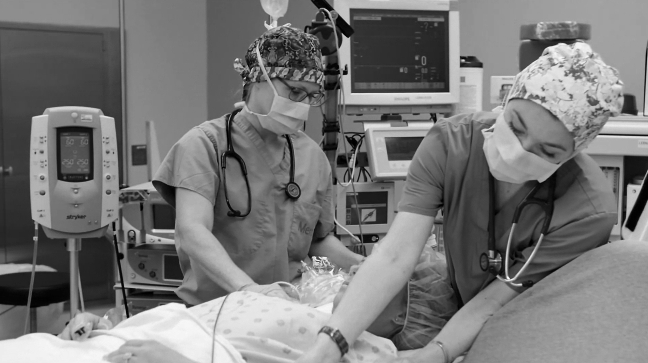 nurses helping a patient