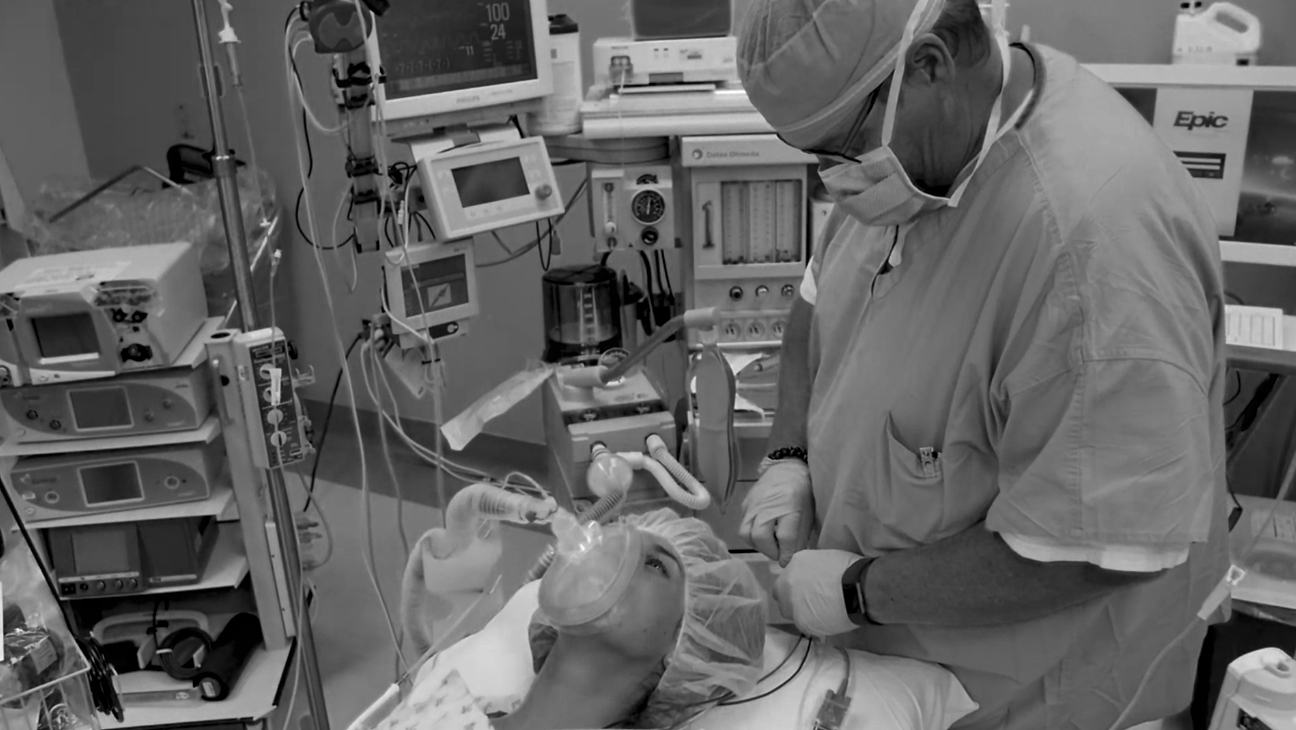 male crna doing anesthesia to a patient