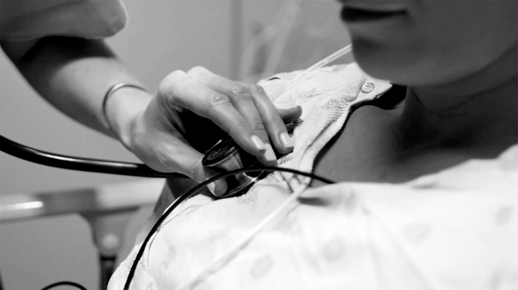 Nurse checking Patient's heartbeat