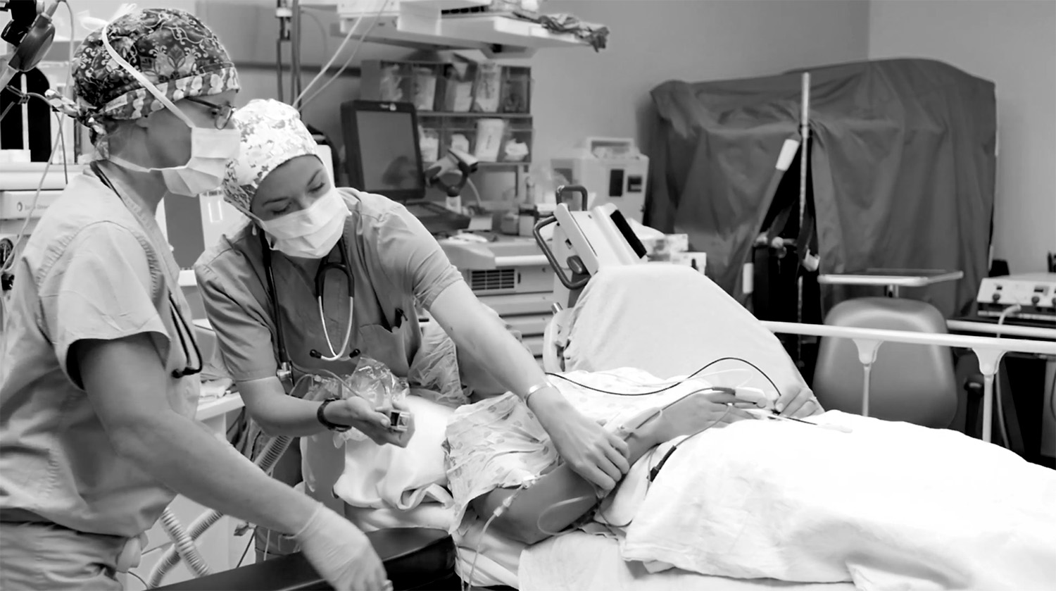 nurses reapplying machines to get the patient to sleep